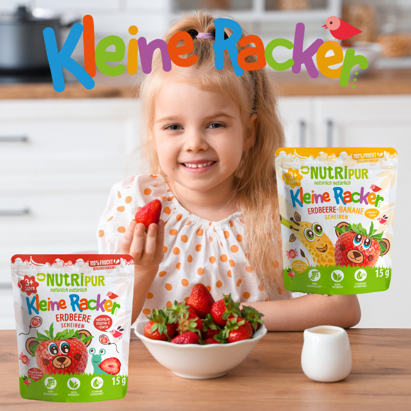 Kleines Mädchen isst Erdbeeren. Nutripur Kleine Racker